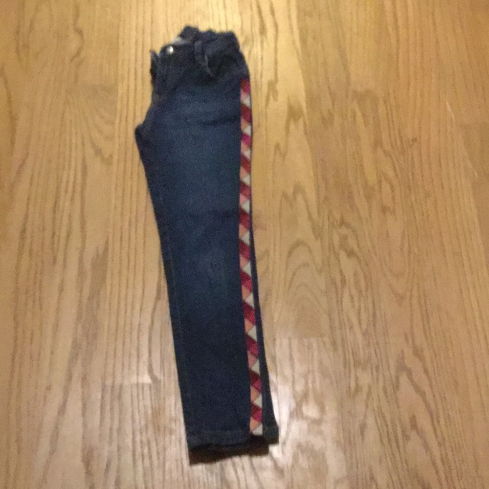 girls jeans with pink pattern on the side